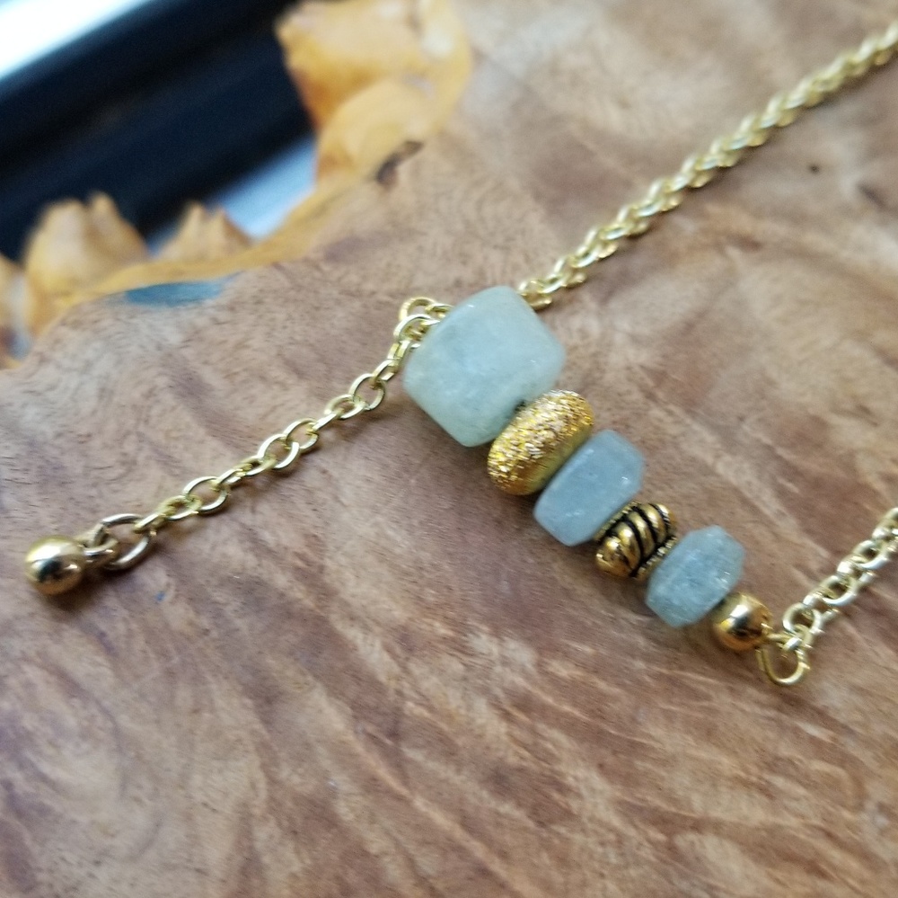 Handmade necklace with gold tone/aquamarine beads